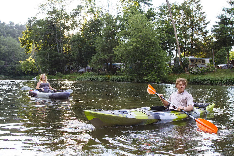 Two people kayaking on the river